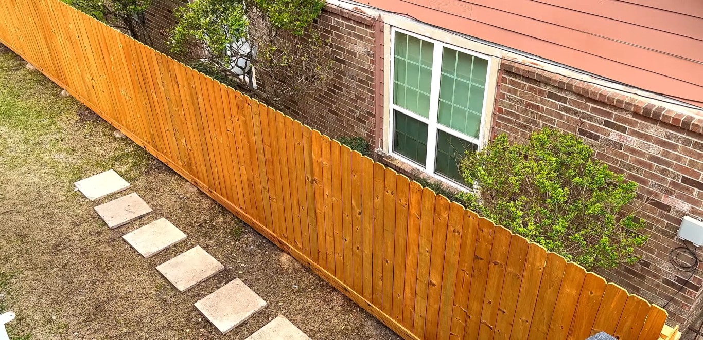 Professional fence installation in Sheboygan, WI backyard